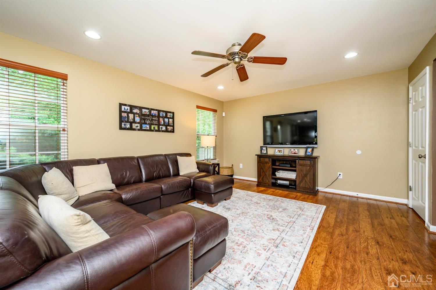 65 Lamp Post Drive Barnegat, NJ 08005 - Photo 6 of 36 a living room with furniture and a flat screen tv