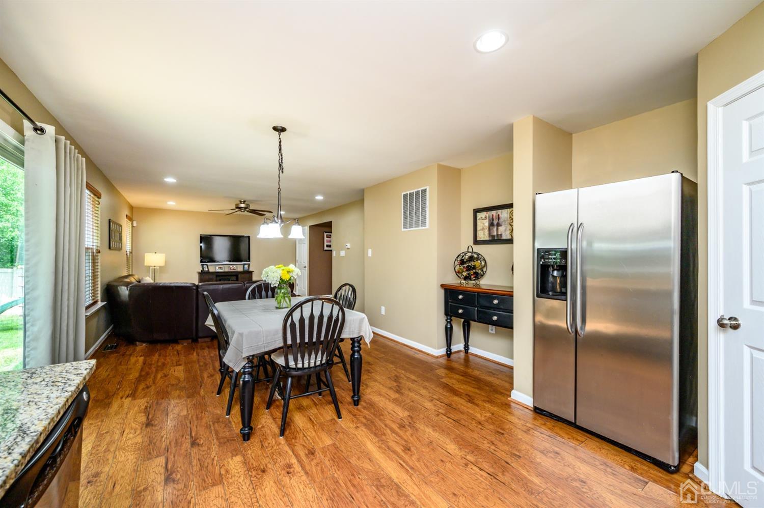 65 Lamp Post Drive Barnegat, NJ 08005 - Photo 9 of 36 a living room with furniture dining table and a refrigerator