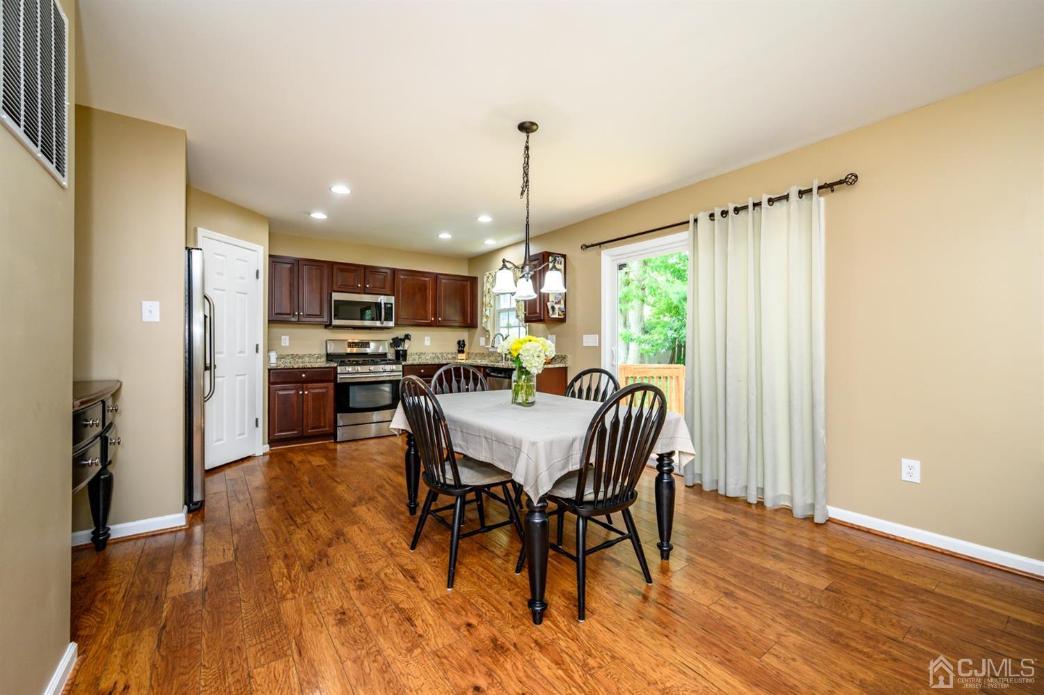 65 Lamp Post Drive Barnegat, NJ 08005 - Photo 10 of 36 a view of a dining room with furniture window and wooden floor