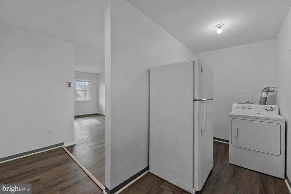 a view of bathroom with washer and dryer