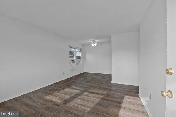 a view of an empty room and window