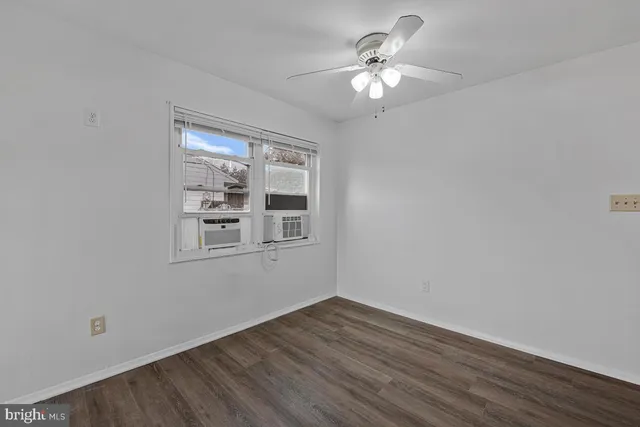 a view of a livingroom with a chandelier fan