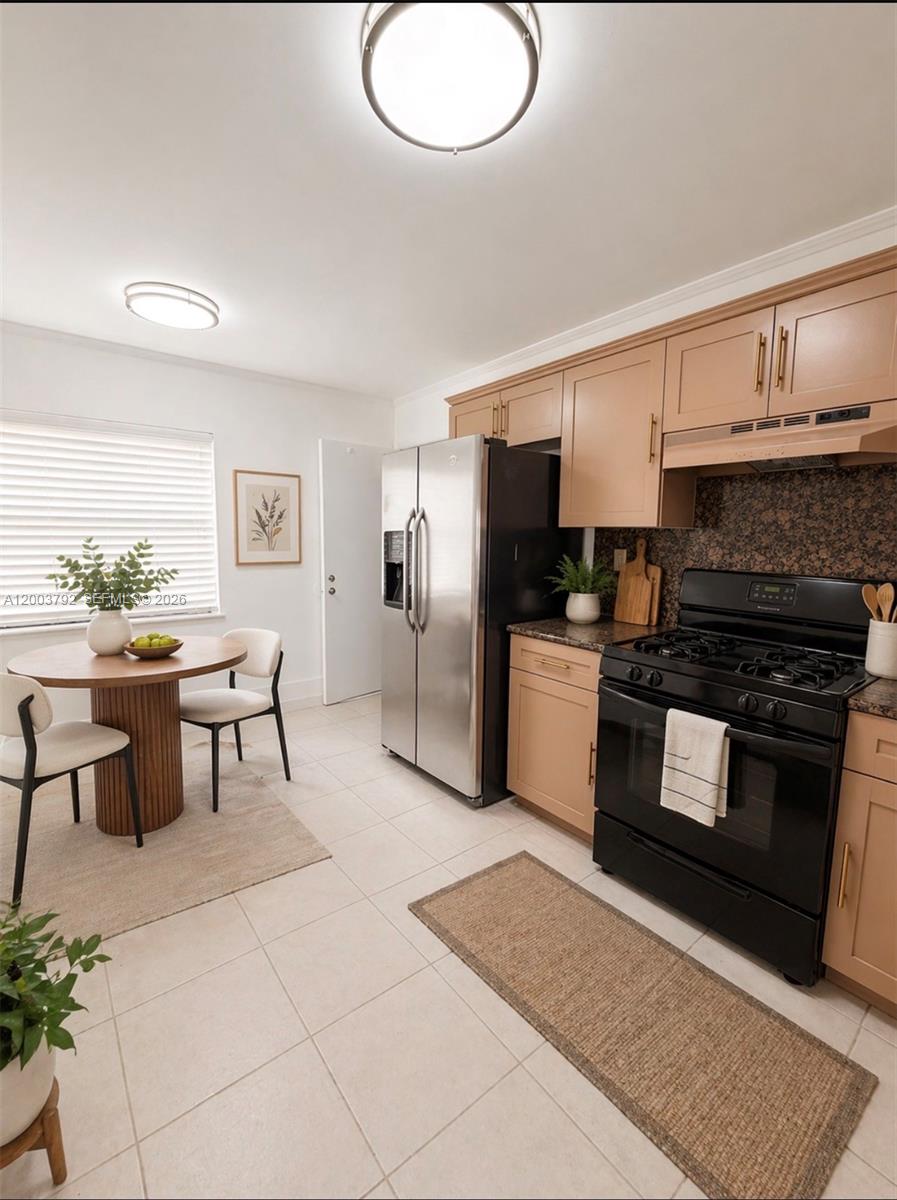 13525 Southwest 115th Place Miami, FL 33176 - Photo 3 of 10 a kitchen with stainless steel appliances granite countertop a stove top oven a sink a counter space and cabinets