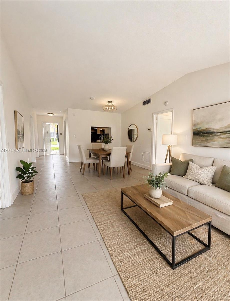 13525 Southwest 115th Place Miami, FL 33176 - Photo 4 of 10 a living room with furniture