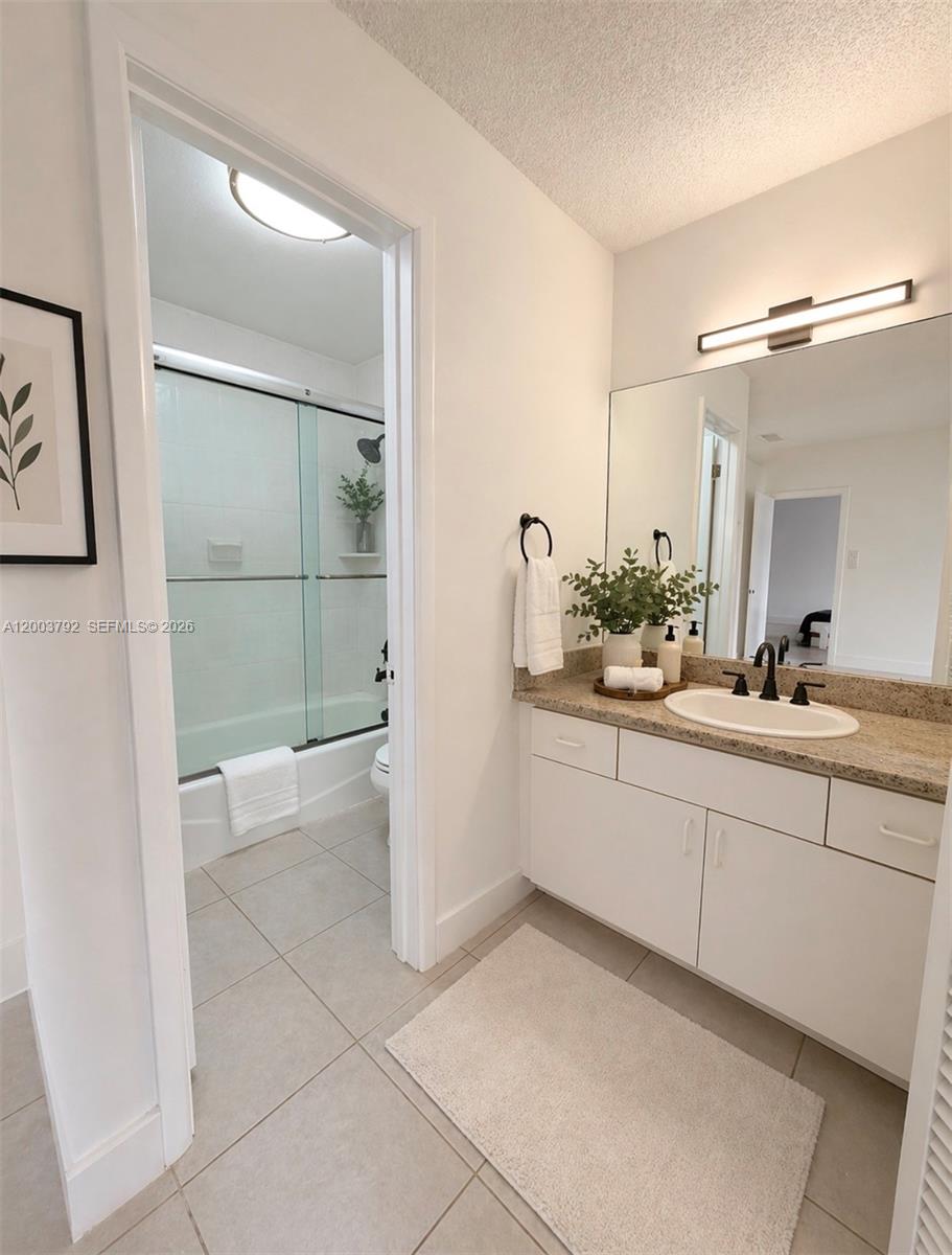 13525 Southwest 115th Place Miami, FL 33176 - Photo 10 of 10 a bathroom with a sink a toilet and shower