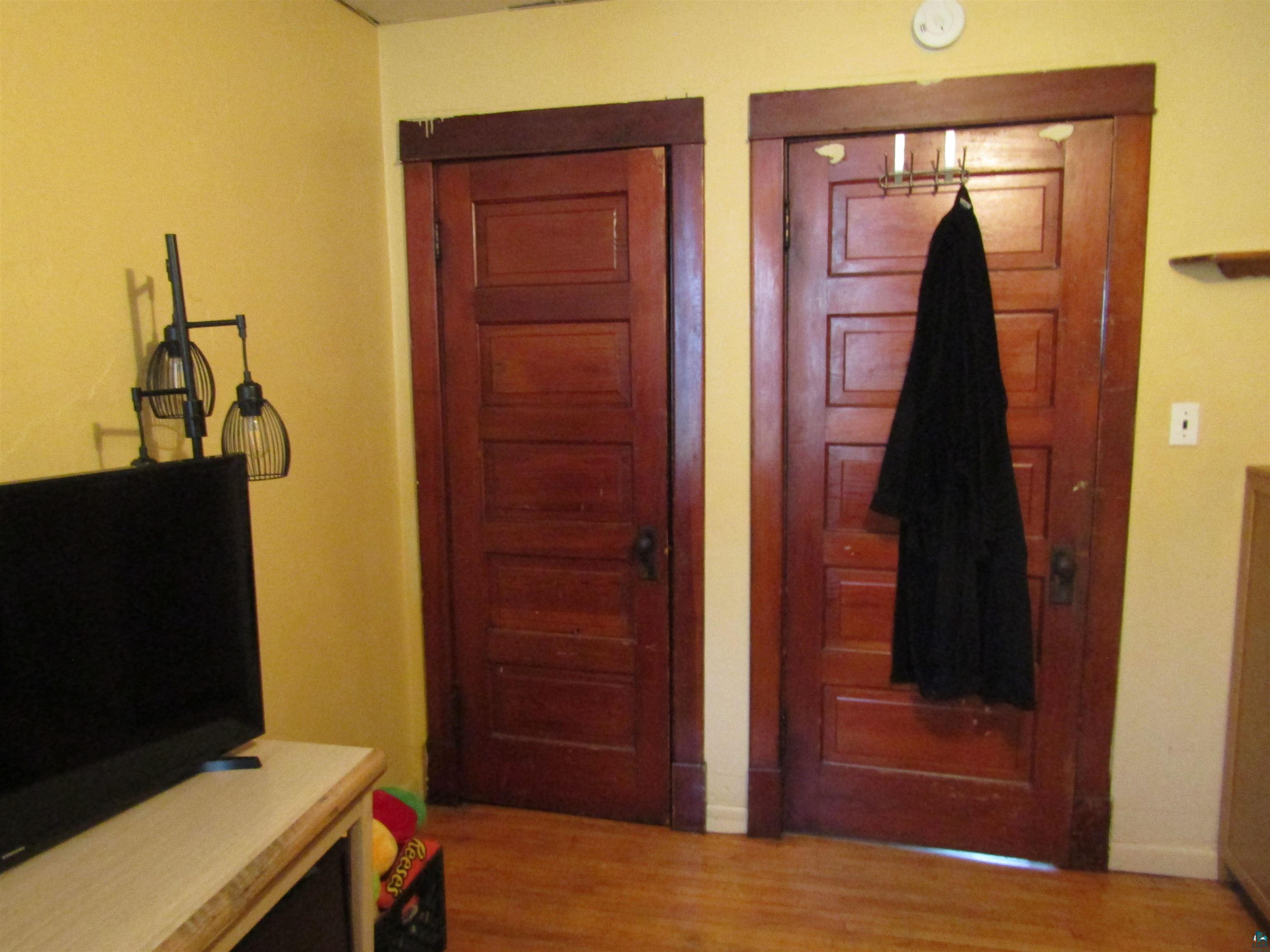 1115 Harrison Street Superior, WI 54880 - Photo 16 of 49 Two panel wood doors with dark wood trim