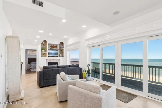 a large kitchen with stainless steel appliances granite countertop a stove and large cabinets