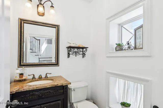 a bathroom with a bathtub a sink and a window