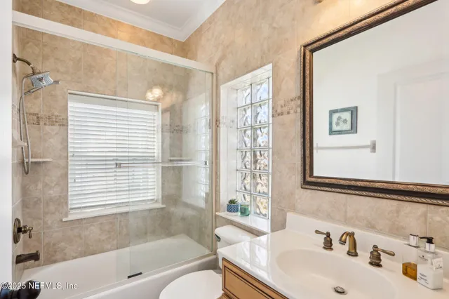 a view of a brick building next to a yard