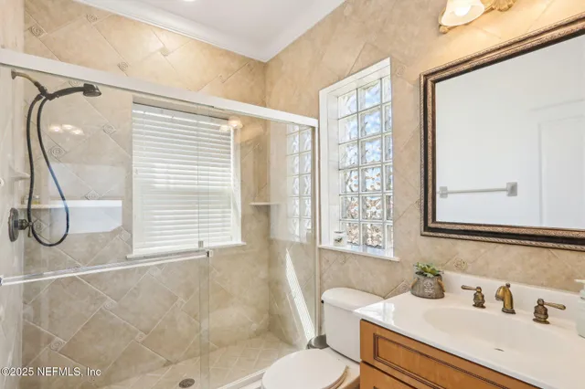 a view of a brick house with many windows