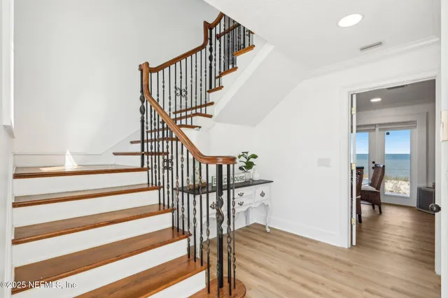 a living room with furniture a rug and a window
