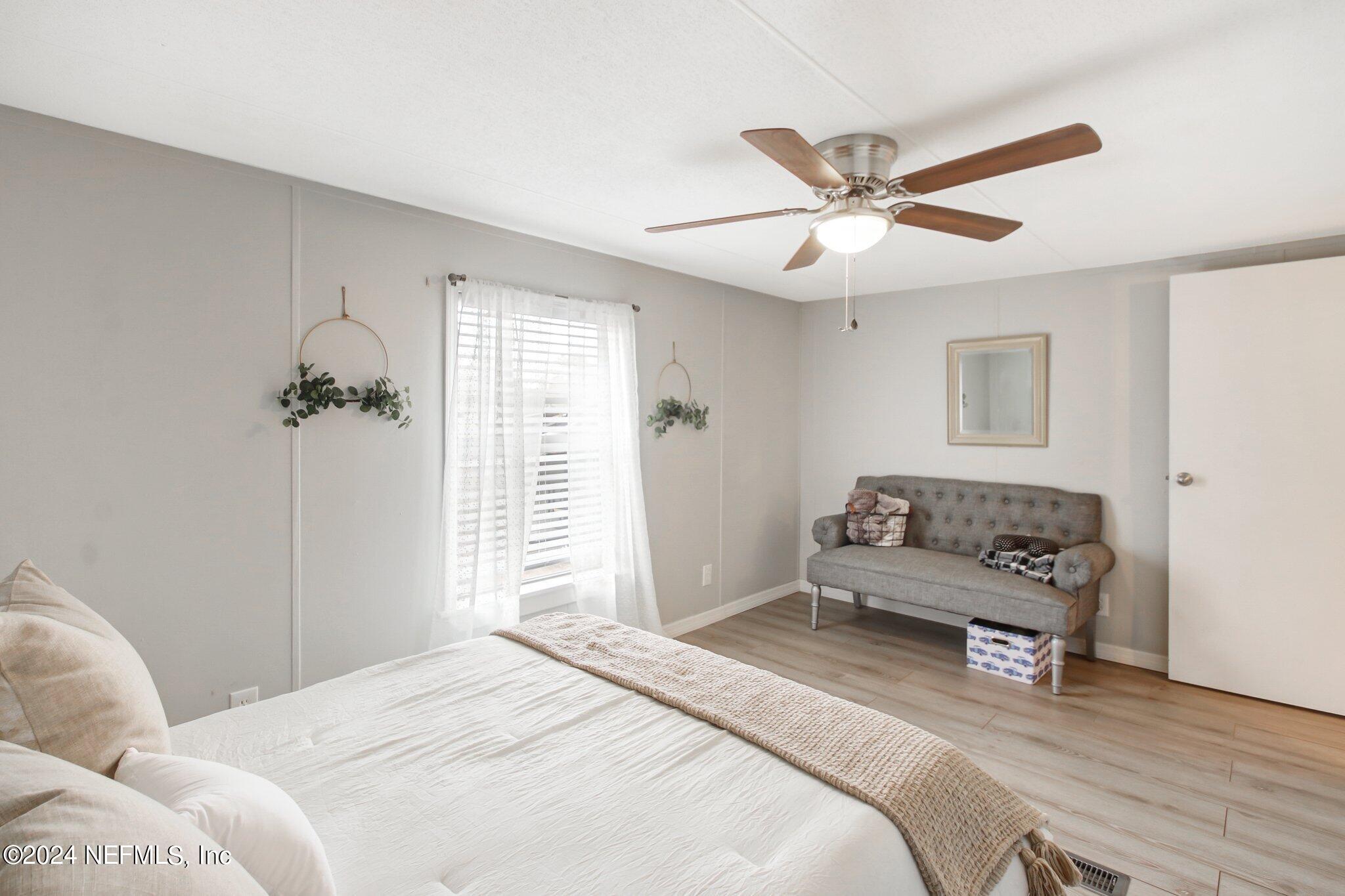 3996 Pinto Road Middleburg, FL 32068 - Photo 23 of 26 a bedroom with a bed and a window