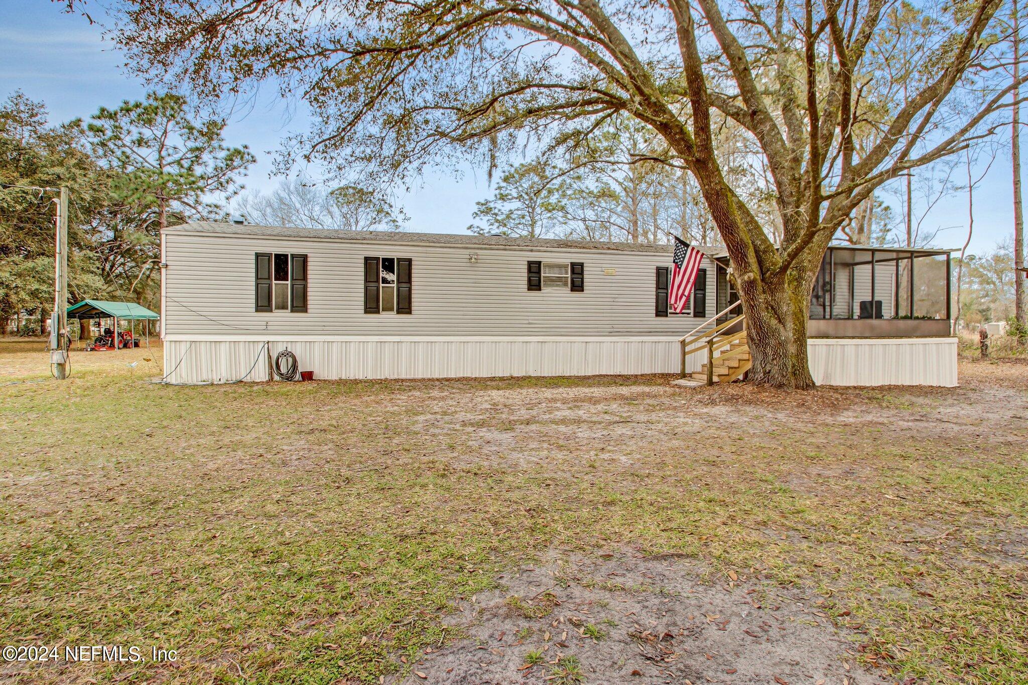 3996 Pinto Road Middleburg, FL 32068 - Photo 4 of 26 a view of a house with a yard