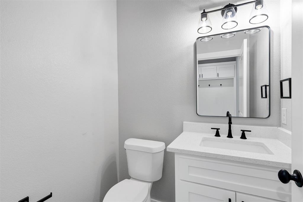 576 Highview Court Godley, TX 76044 - Photo 14 of 40 a bathroom with a sink a toilet and mirror