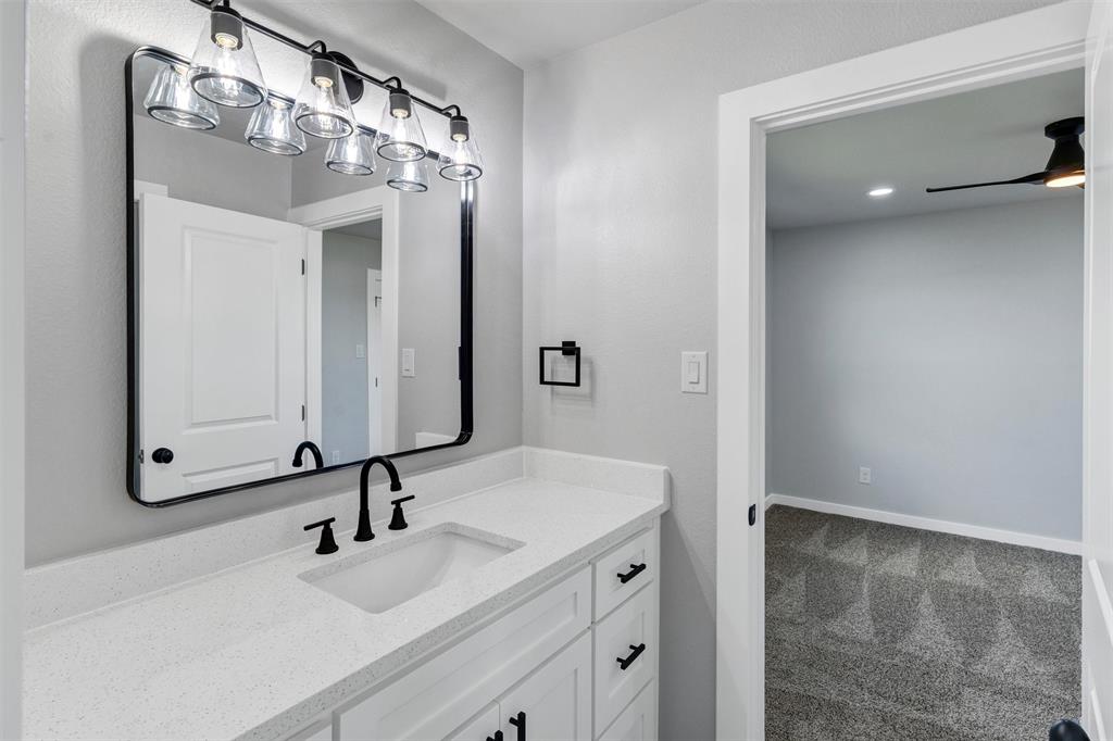 576 Highview Court Godley, TX 76044 - Photo 32 of 40 a bathroom with a sink and a mirror