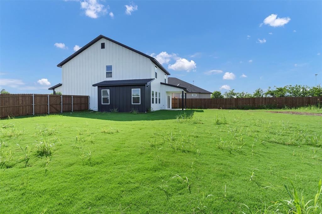 576 Highview Court Godley, TX 76044 - Photo 37 of 40 a view of a house with a big yard