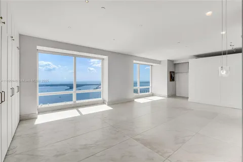 a view of an empty room with a fireplace