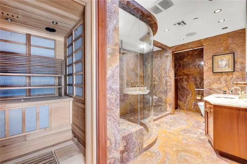 a view of a hallway with wooden floor and a large window