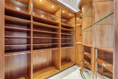 a view of an empty room with empty shelves