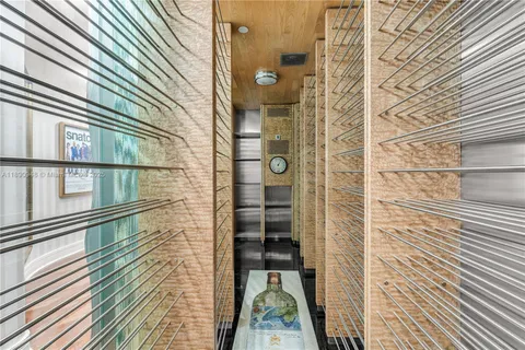 a view of a balcony with wooden floor and a shower