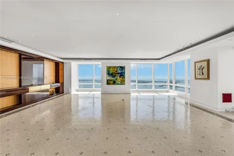 a view of a living room hardwood floor and a window