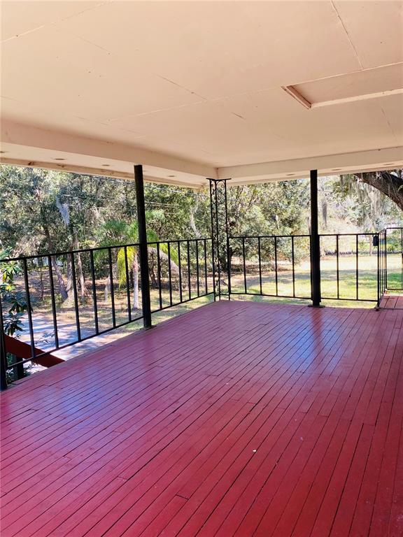 1334 Livingston Road Lutz, FL 33559 - Photo 2 of 7 wooden floor with a roof deck