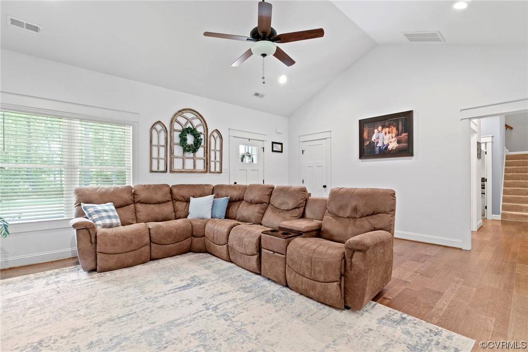 1110 Dorset Road Moseley, VA 23120 - Photo 17 of 32 a living room with furniture a large window and a chandelier