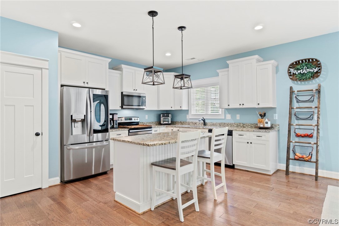 1110 Dorset Road Moseley, VA 23120 - Photo 18 of 32 a kitchen with white cabinets and stainless steel appliances