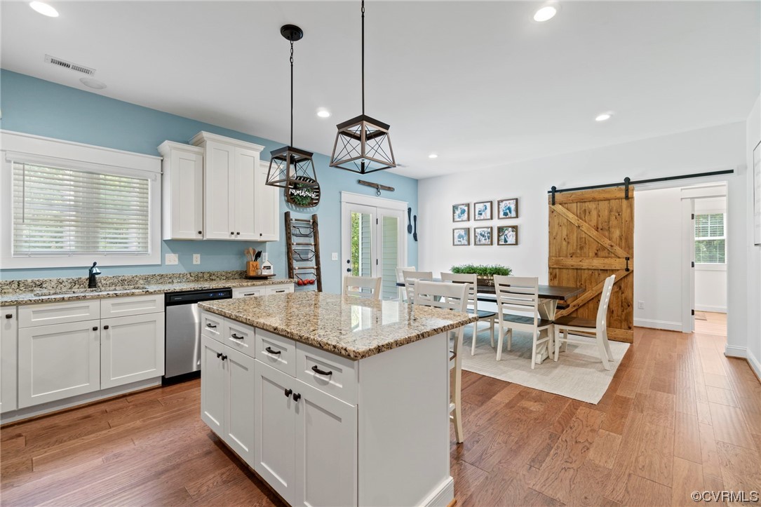 1110 Dorset Road Moseley, VA 23120 - Photo 19 of 32 a very nice looking kitchen with granite countertop a stove two sinks a dining table and chairs