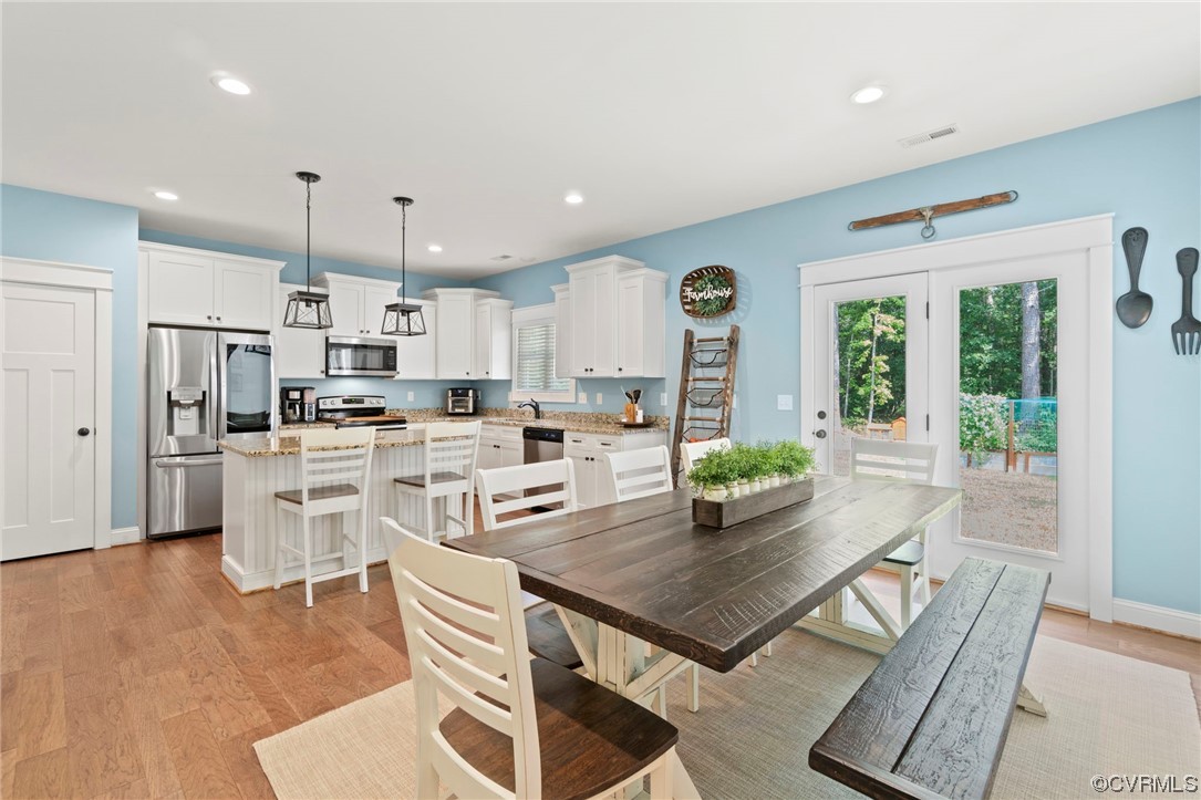 1110 Dorset Road Moseley, VA 23120 - Photo 25 of 32 a kitchen with white cabinets and stainless steel appliances