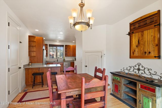 a very nice looking dining room with a table and chairs