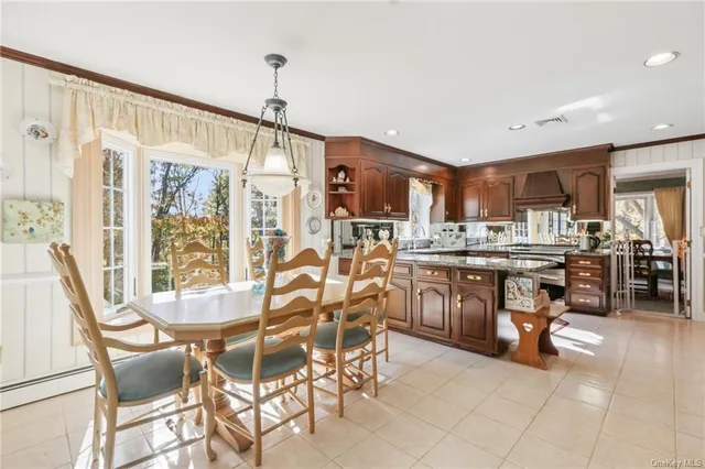 a view of a dining room kitchen and a window