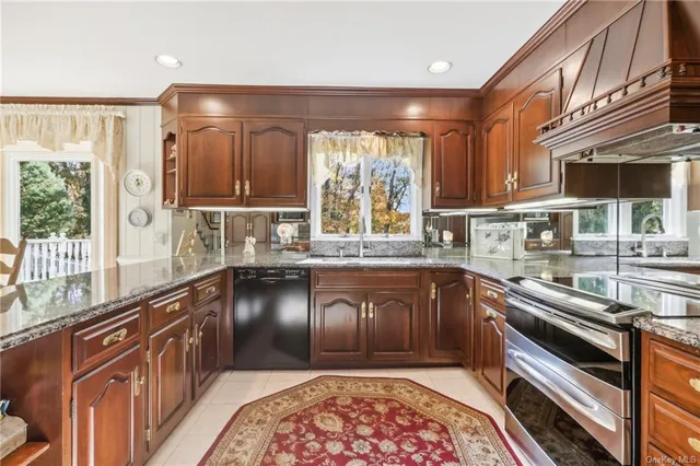 a kitchen with a refrigerator stove and sink