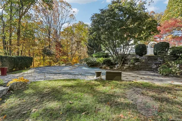 a water view of a house with a yard
