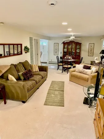 a bathroom with a granite countertop sink a mirror and shower