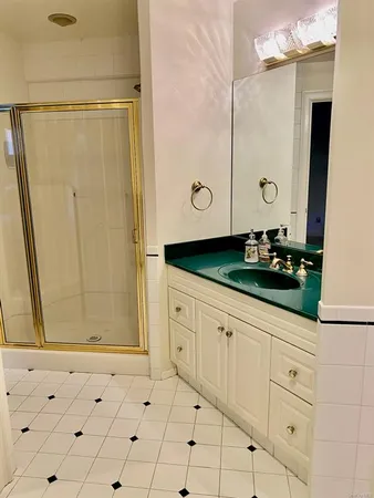 a close up view of a washer dryer with white cabinets