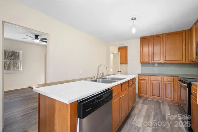 a kitchen with a sink stove and cabinets