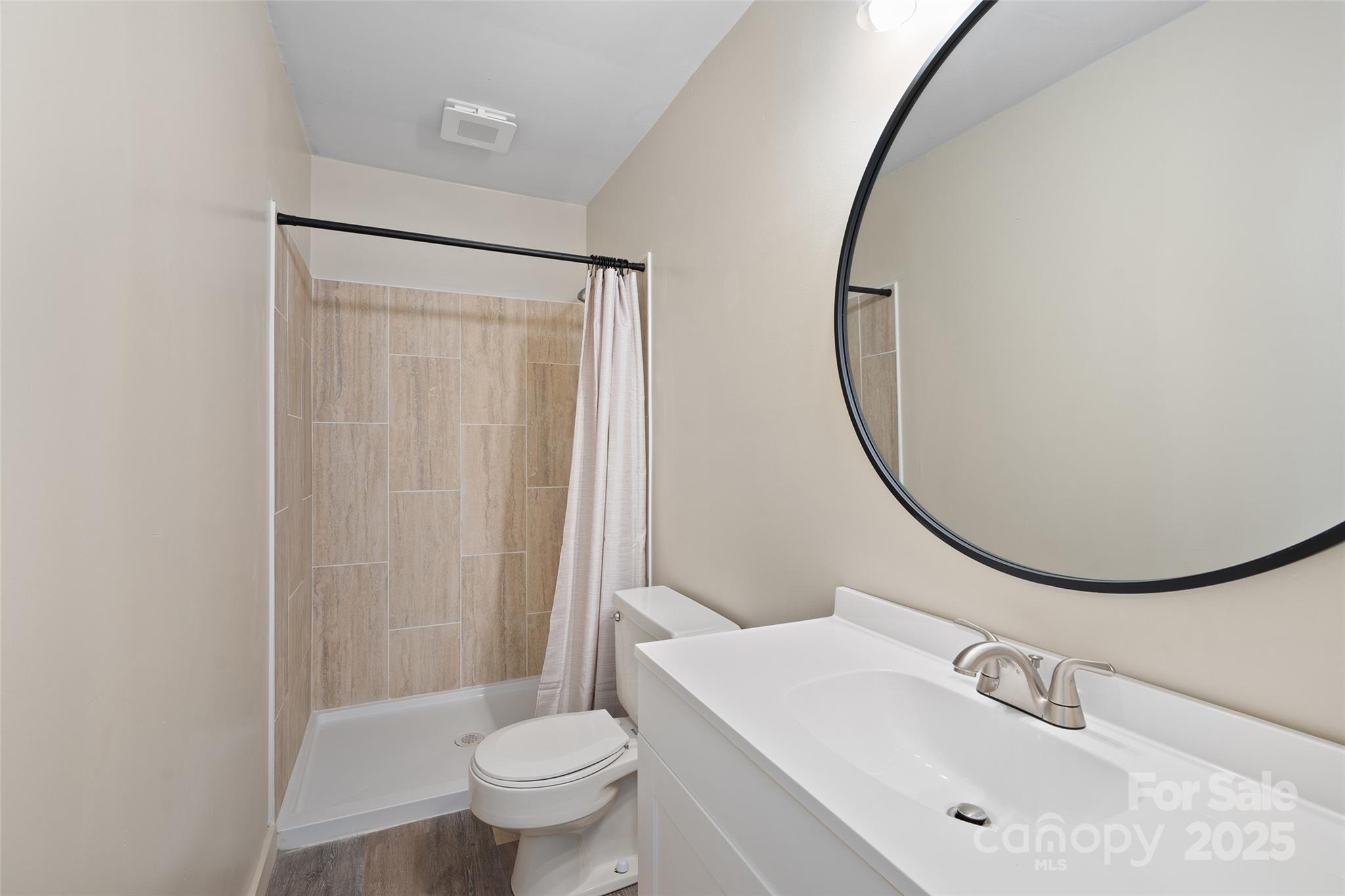 1901 Murray Road Canton, NC 28716 - Photo 15 of 21 a bathroom with a sink toilet and a mirror