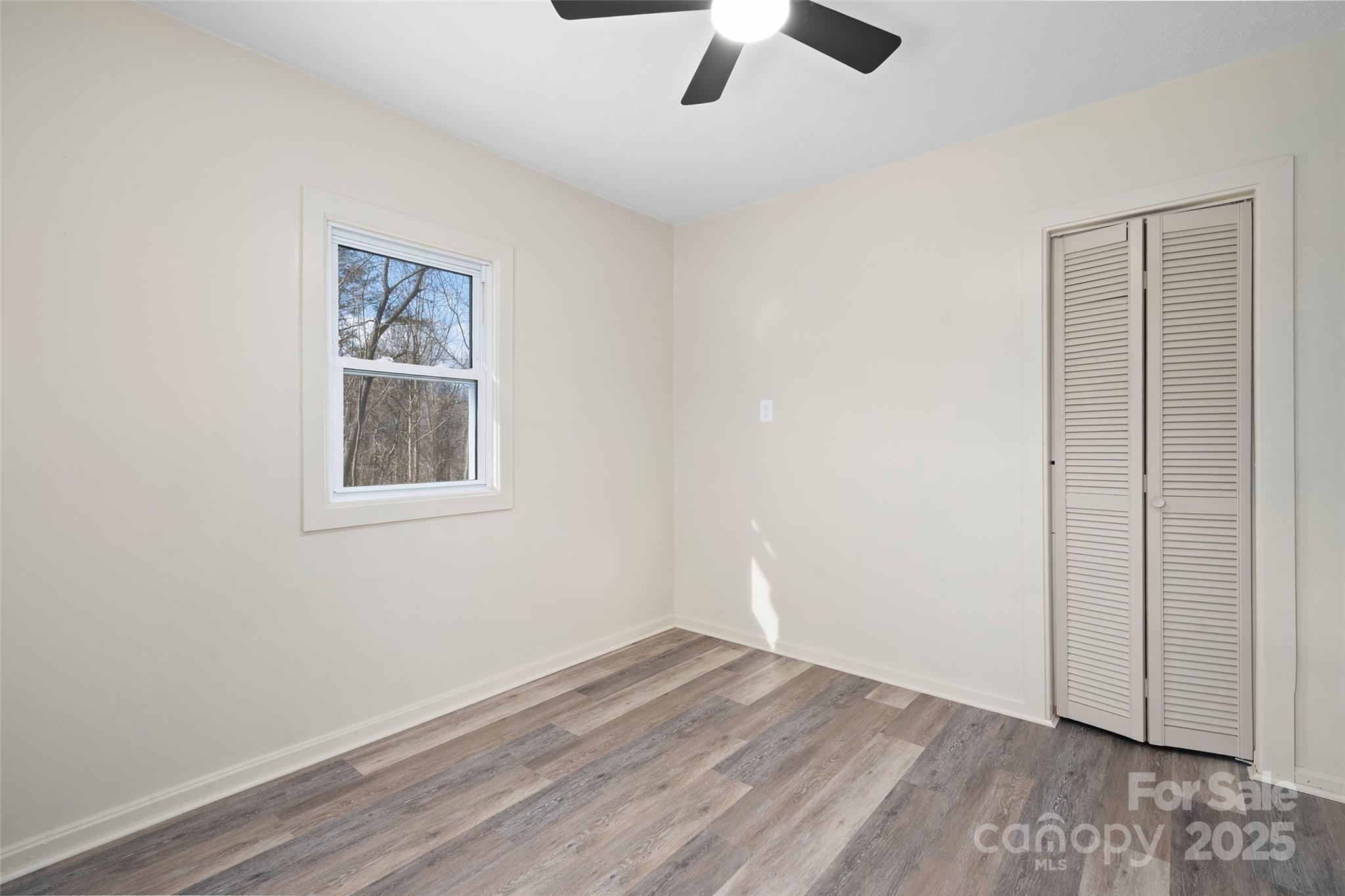 1901 Murray Road Canton, NC 28716 - Photo 16 of 21 wooden floor in an empty room with a window