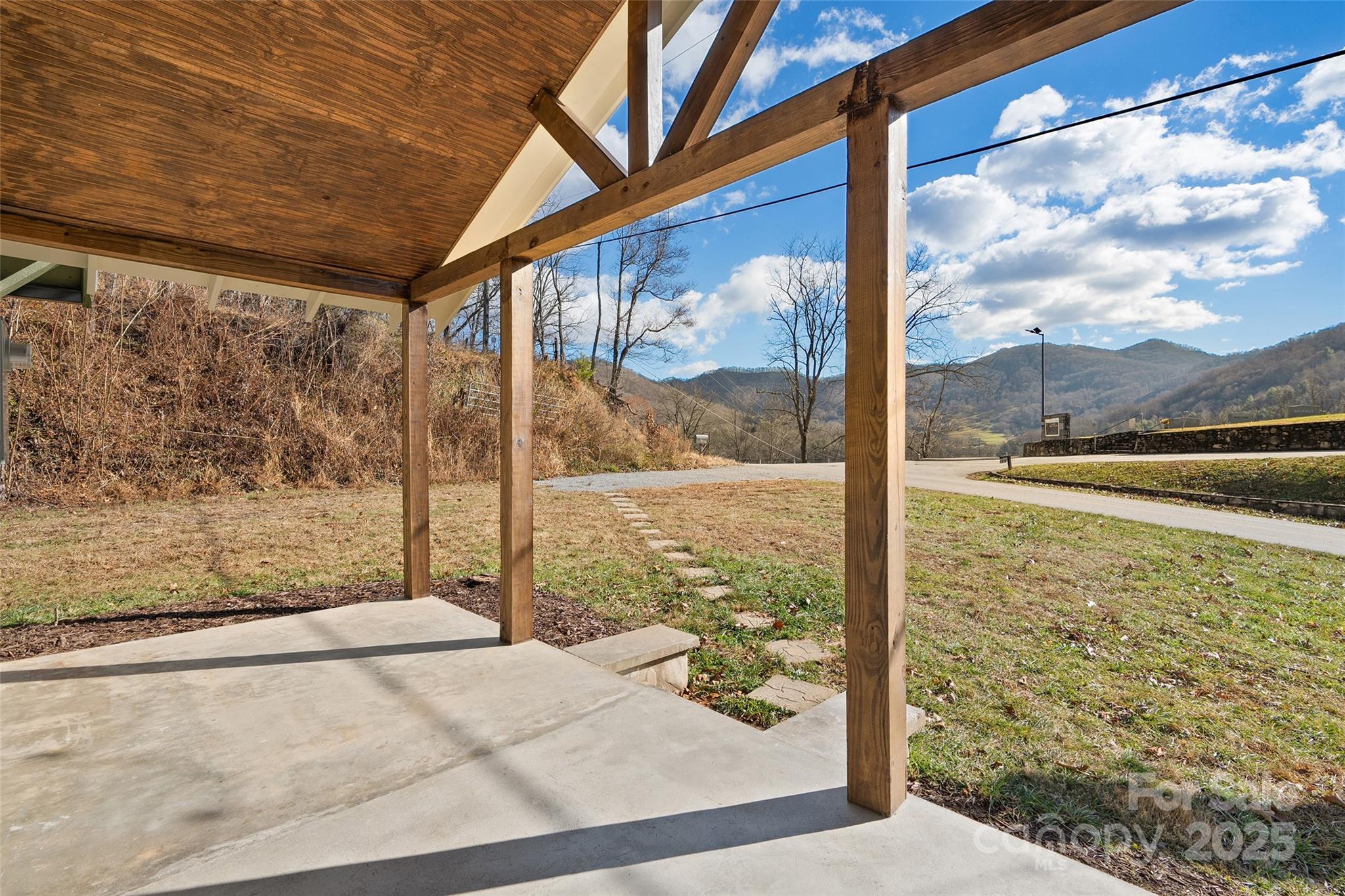 1901 Murray Road Canton, NC 28716 - Photo 2 of 21 a view of a porch with a floor to ceiling window next to a yard