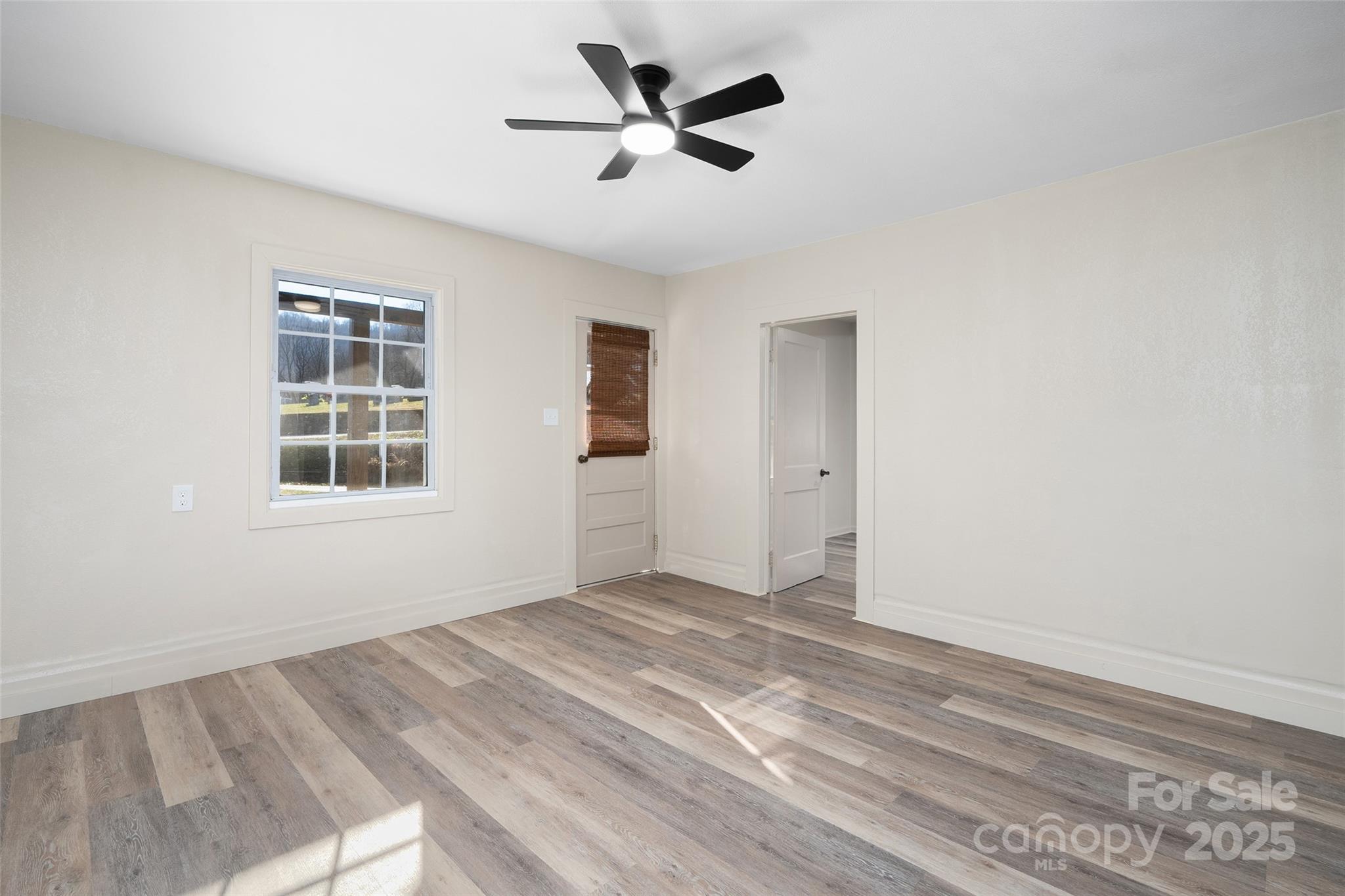 1901 Murray Road Canton, NC 28716 - Photo 7 of 21 wooden floor in an empty room with a window