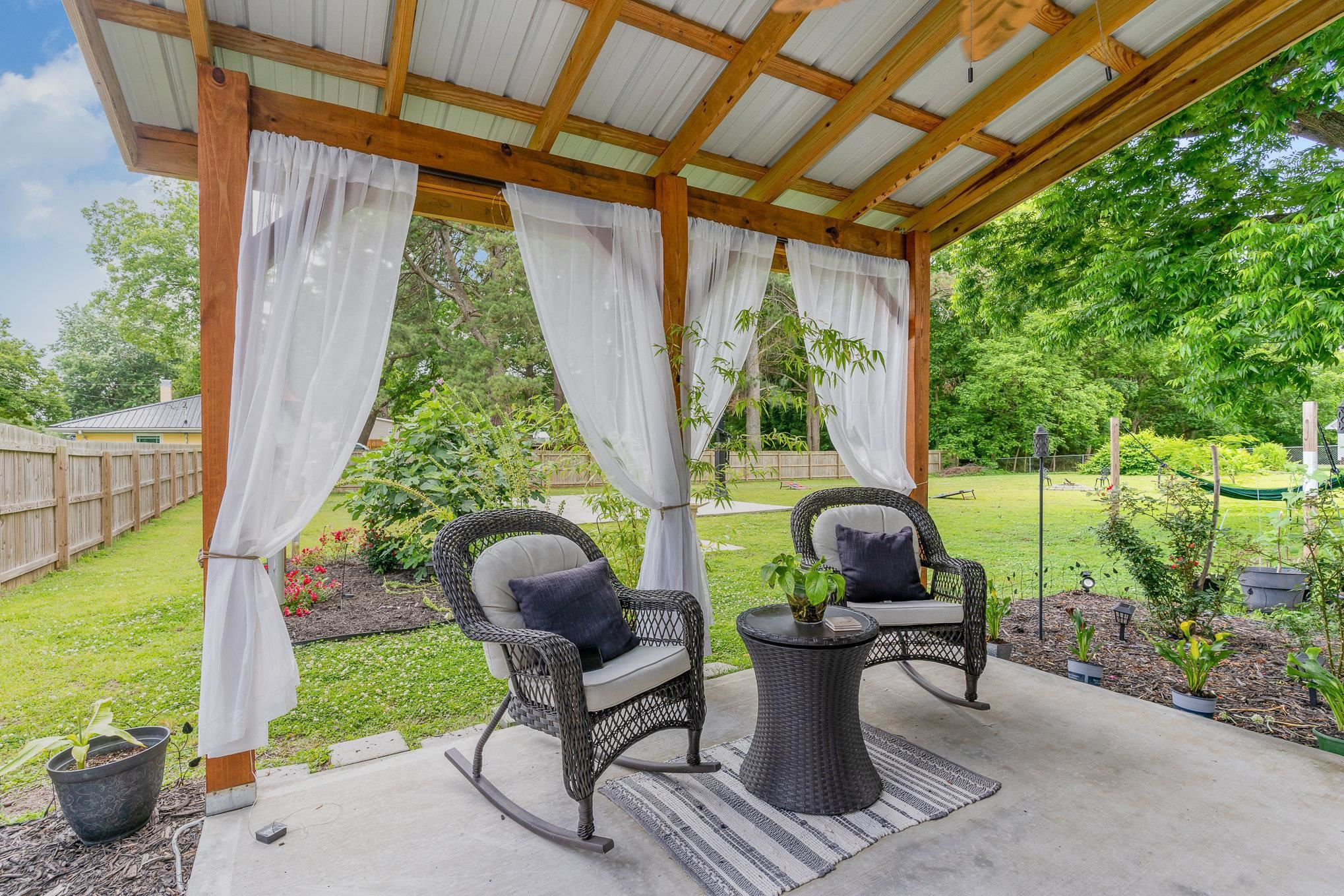 327 2nd Street Spring Hope, NC 27882 - Photo 14 of 20 a view of a porch with furniture and garden