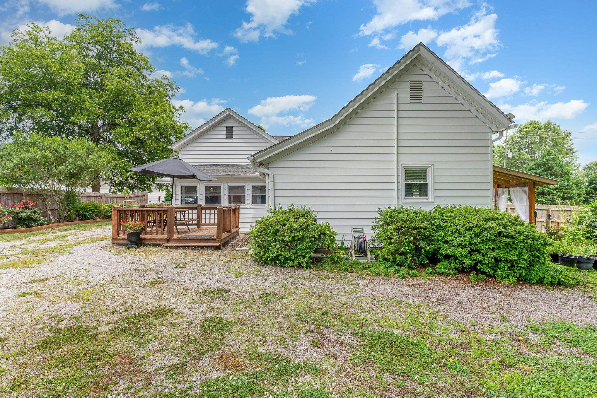 327 2nd Street Spring Hope, NC 27882 - Photo 16 of 20 a view of a house with backyard porch and garden