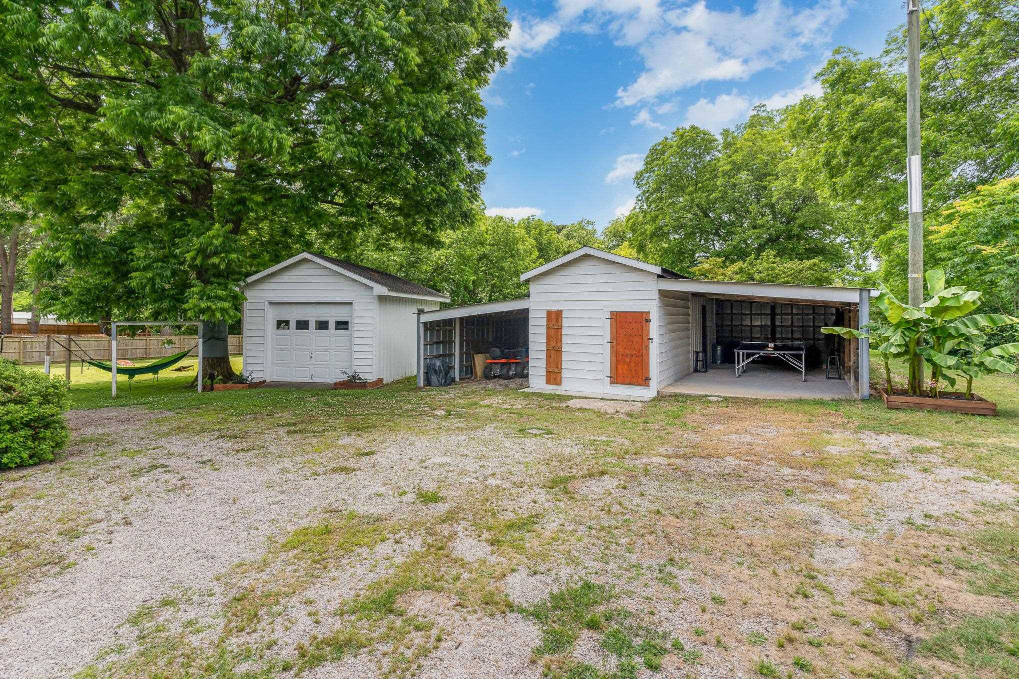 327 2nd Street Spring Hope, NC 27882 - Photo 17 of 20 a front view of a house with a yard and garage