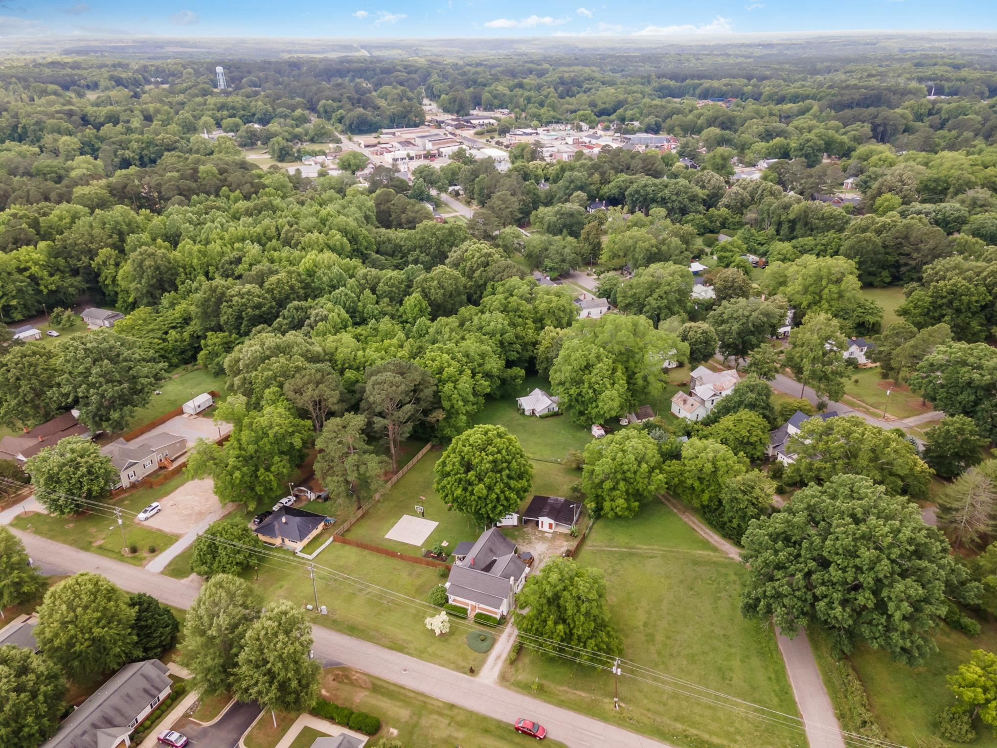 327 2nd Street Spring Hope, NC 27882 - Photo 19 of 20 an aerial view of a residential houses covered in trees