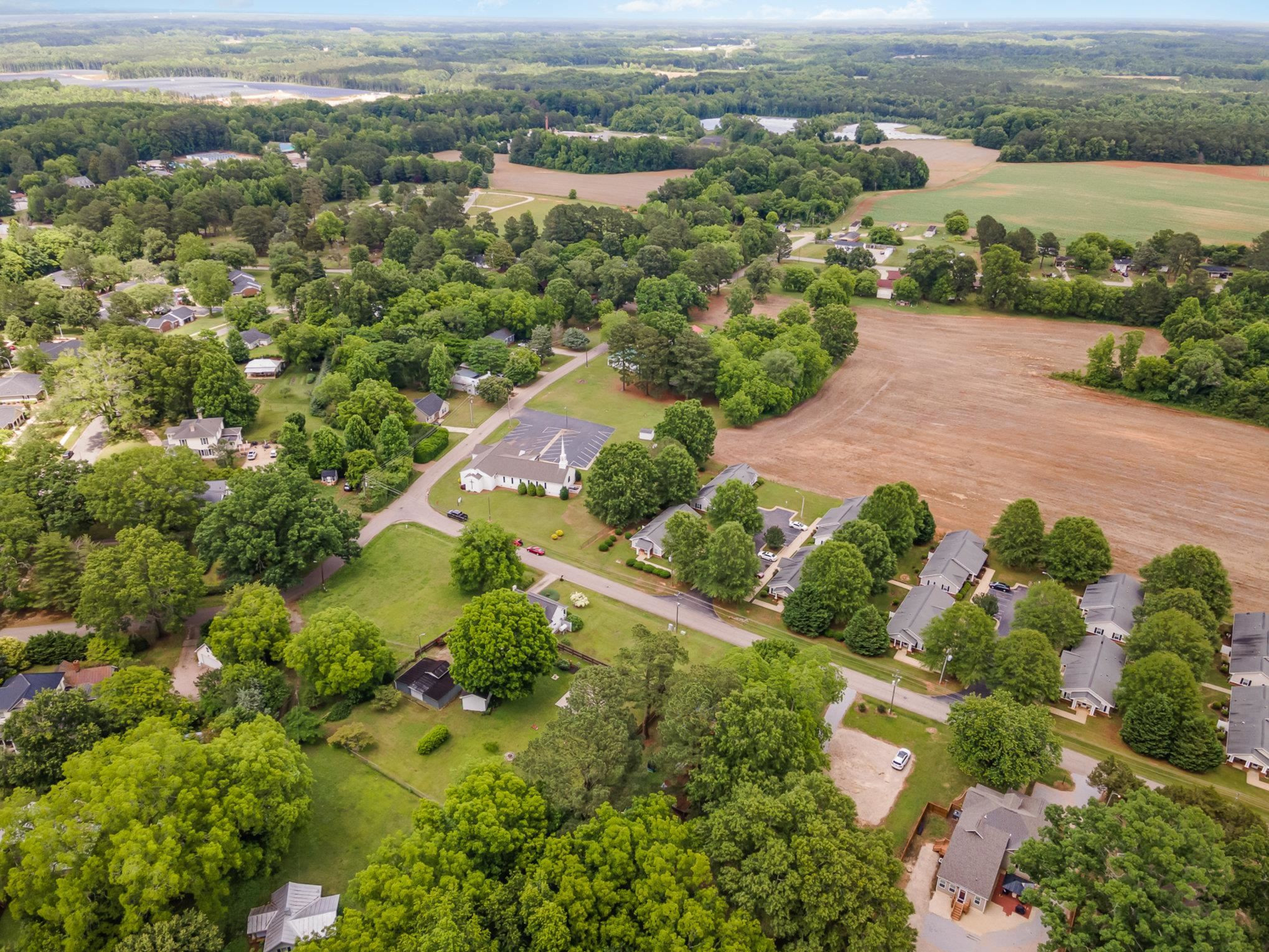 327 2nd Street Spring Hope, NC 27882 - Photo 20 of 20 an aerial view of a residential houses with outdoor space and trees