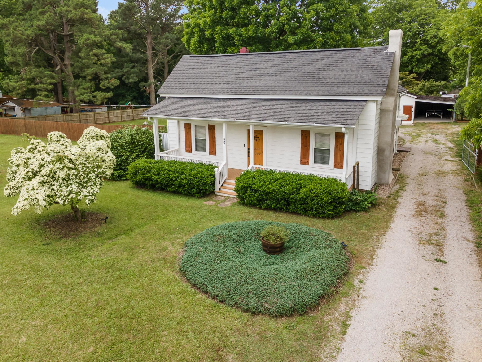 327 2nd Street Spring Hope, NC 27882 - Photo 3 of 20 a view of a house with garden