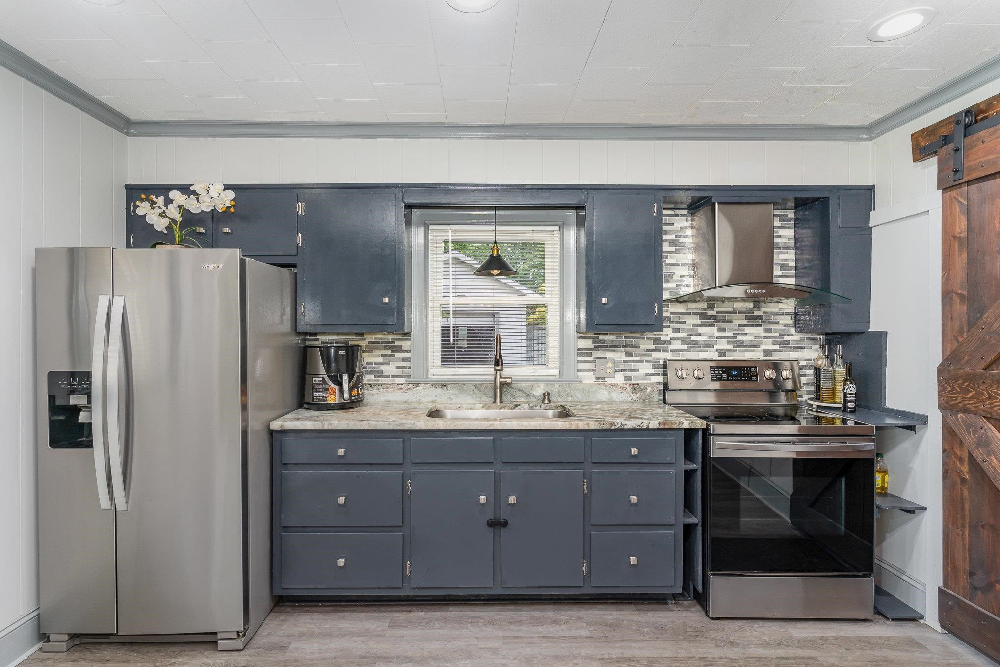 327 2nd Street Spring Hope, NC 27882 - Photo 8 of 20 a kitchen with a sink and refrigerator