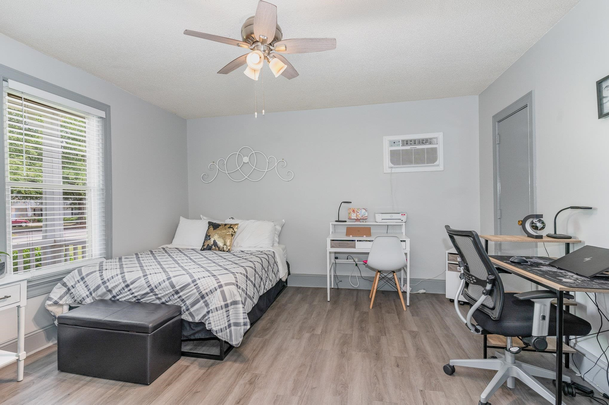 327 2nd Street Spring Hope, NC 27882 - Photo 10 of 20 a bedroom with a bed and a table in it