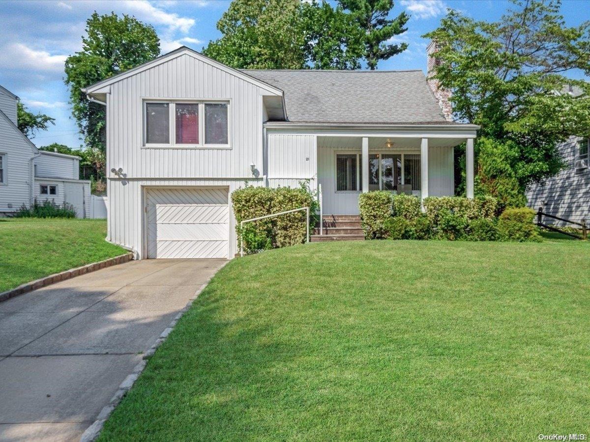 21 Preston Road Great Neck, NY 11023 - Photo 1 of 1 a front view of house with yard and green space